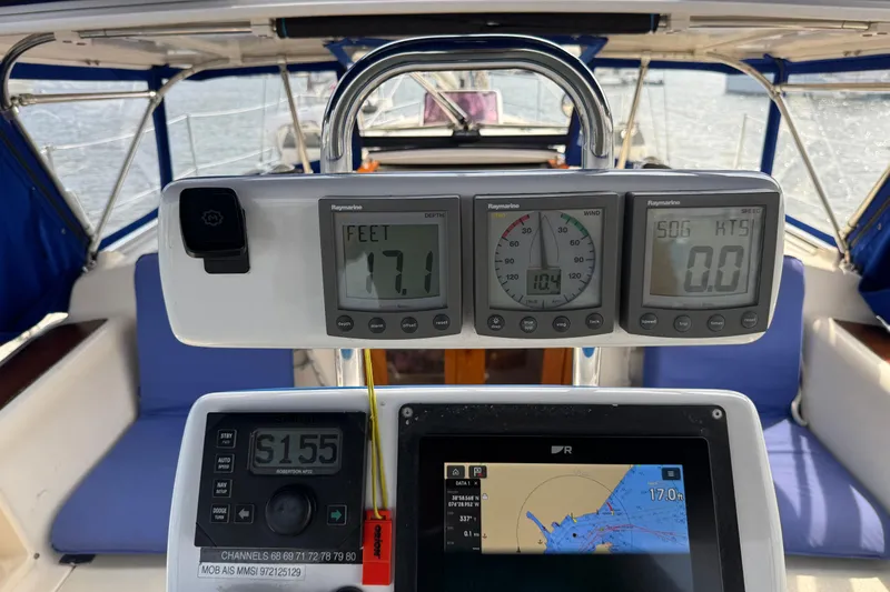 Mer Du Jour Yacht Photos Pics Cockpit of 2005 Caliber 40 LRC SE sailboat with navigation instruments and displays.