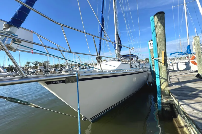 Mer Du Jour Yacht Photos Pics 2005 Caliber 40 LRC SE sailboat docked at marina under clear blue sky.