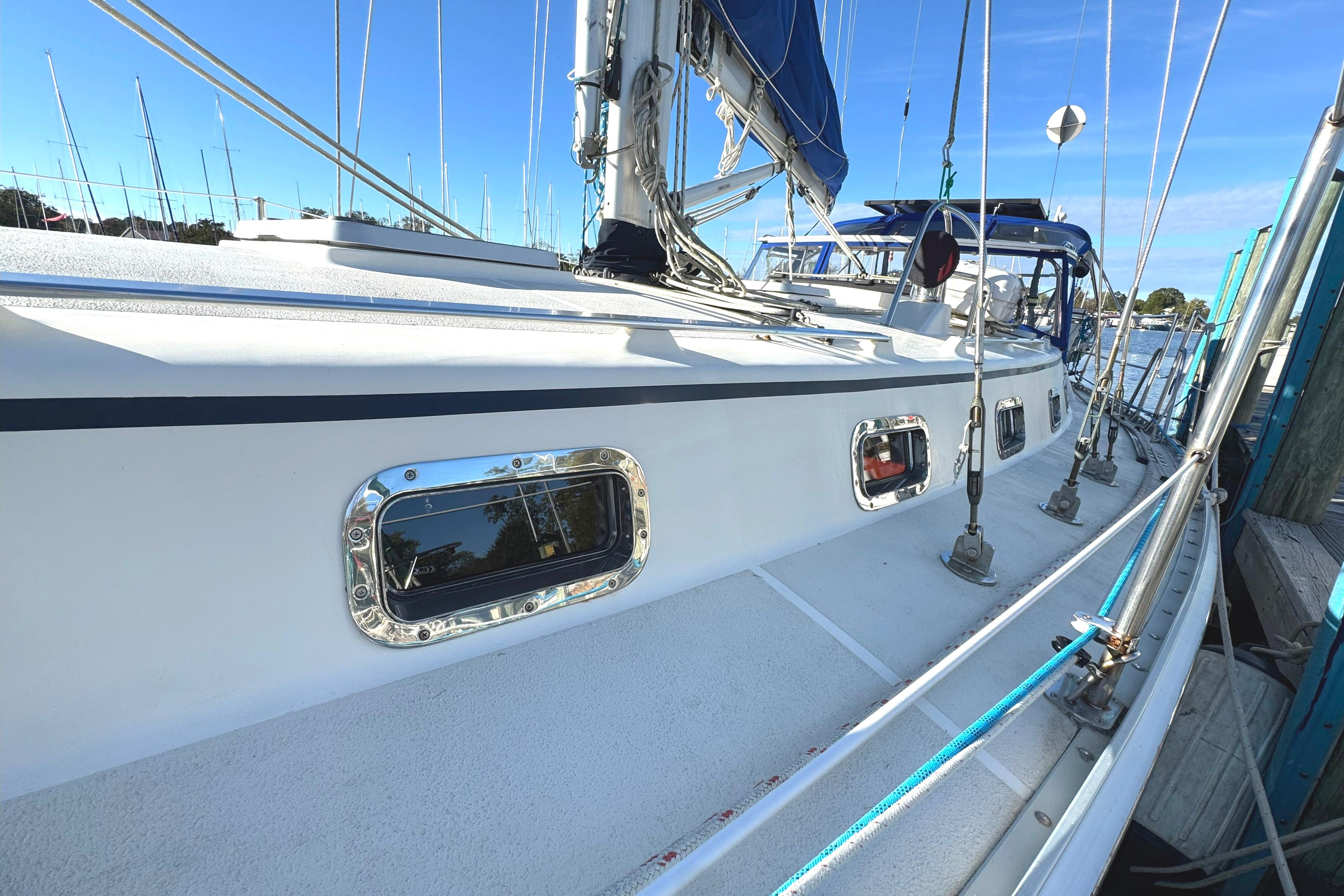 2005 Caliber 40 LRC SE sailboat docked, showcasing sleek design and polished details.