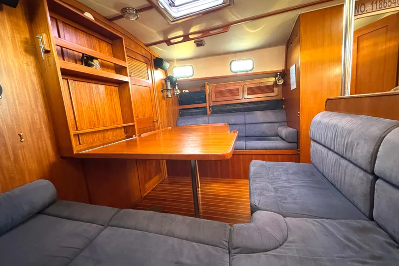Mer Du Jour Yacht Photos Pics Interior of 2005 Caliber 40 LRC SE yacht with wooden furnishings and cozy seating.
