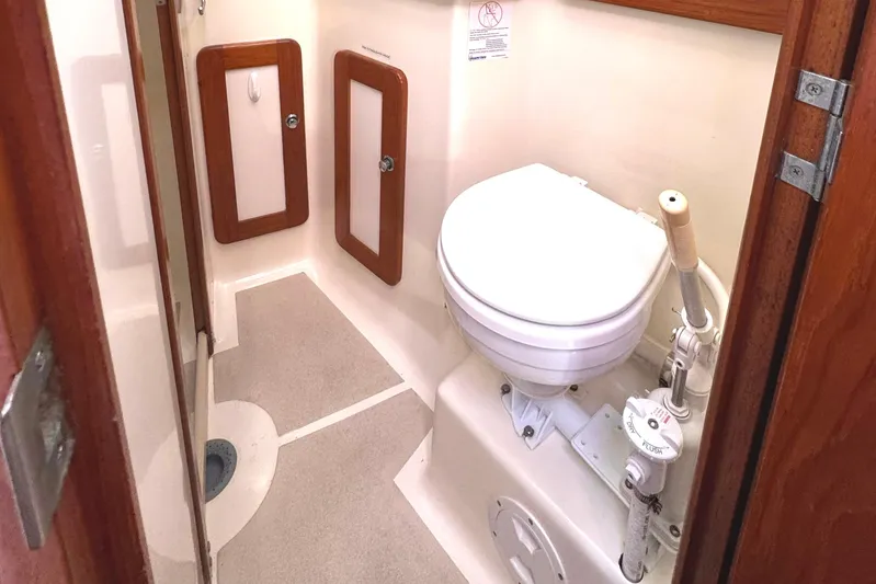 Mer Du Jour Yacht Photos Pics Compact marine bathroom in 2005 Caliber 40 LRC SE yacht with manual toilet.