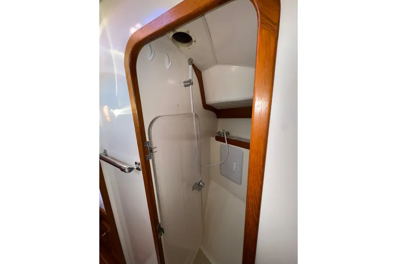 Mer Du Jour Yacht Photos Pics 2005 Caliber 40 LRC SE yacht shower with wooden trim and compact design.