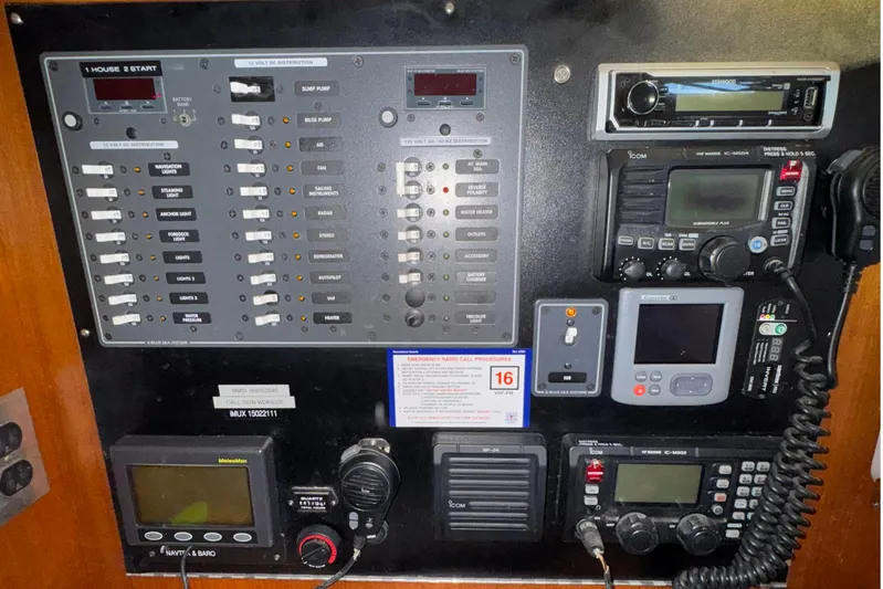 Mer Du Jour Yacht Photos Pics Control panel of a 2005 Caliber 40 LRC SE yacht with navigation and communication equipment.