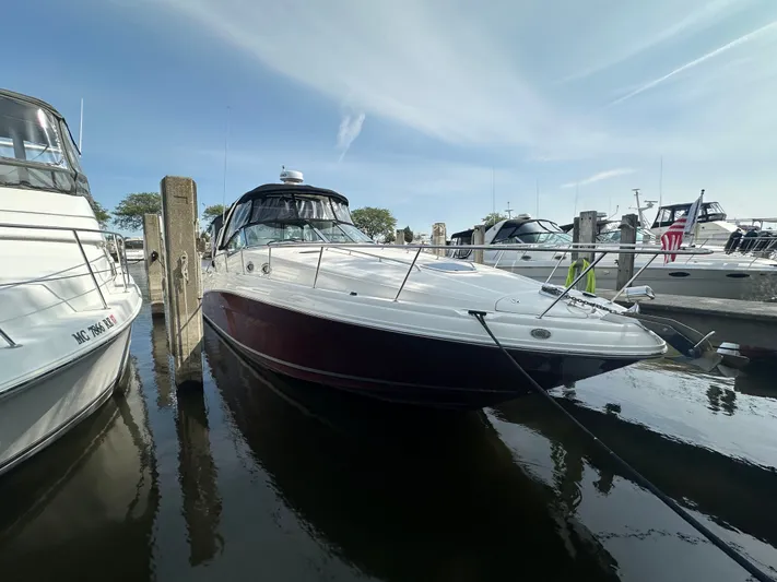  Yacht Photos Pics 2007 Sea Ray 340 Sundancer docked at marina, clear sky background.