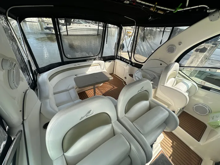  Yacht Photos Pics Interior of 2007 Sea Ray 340 Sundancer yacht with white seating and wooden flooring.
