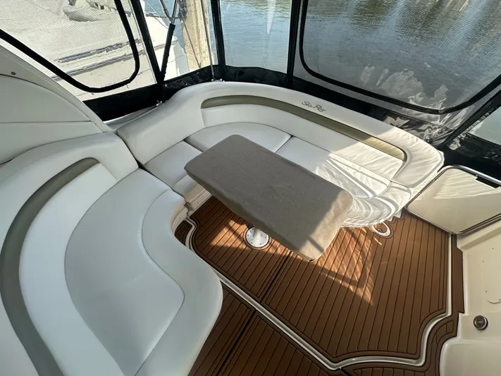  Yacht Photos Pics 2007 Sea Ray 340 Sundancer interior with white seating and wooden flooring.