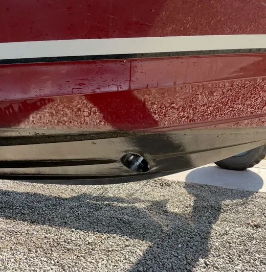  Yacht Photos Pics Close-up of 2007 Sea Ray 340 Sundancer hull with visible drain plug.