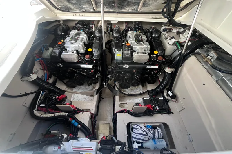 Just Plane Fun Yacht Photos Pics Engine compartment of a 2014 Sea Ray 350 Sundancer, showcasing dual engines and wiring.