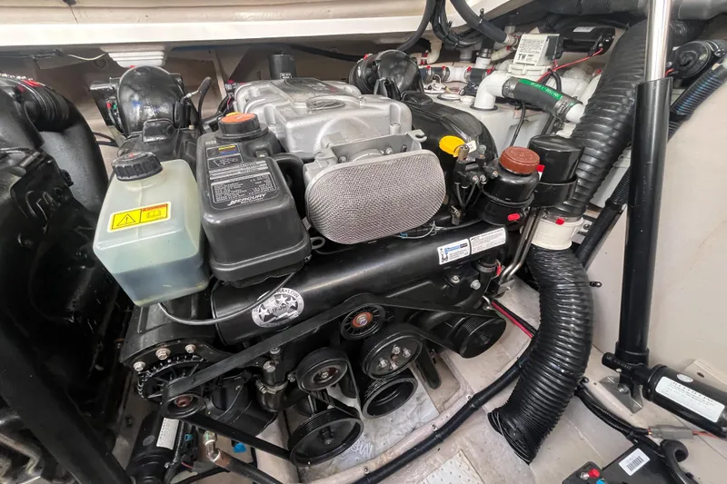 Just Plane Fun Yacht Photos Pics Engine compartment of a 2014 Sea Ray 350 Sundancer boat, showcasing mechanical components.