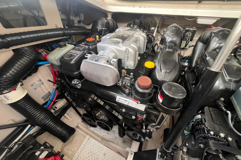 Just Plane Fun Yacht Photos Pics Engine compartment of a 2014 Sea Ray 350 Sundancer boat, showcasing detailed components.