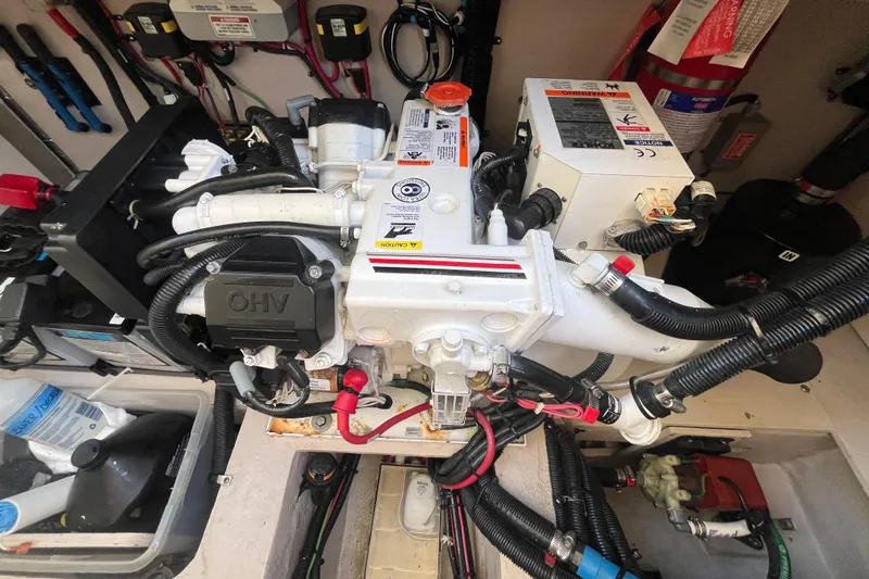 Just Plane Fun Yacht Photos Pics Engine compartment of a 2014 Sea Ray 350 Sundancer with visible wiring and components.