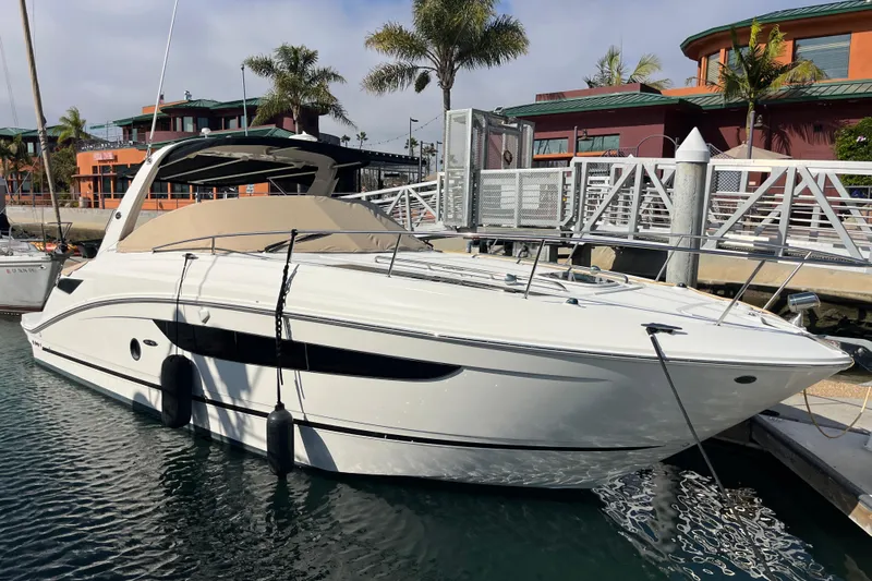 Just Plane Fun Yacht Photos Pics 2014 Sea Ray 350 Sundancer docked at marina with palm trees and buildings.