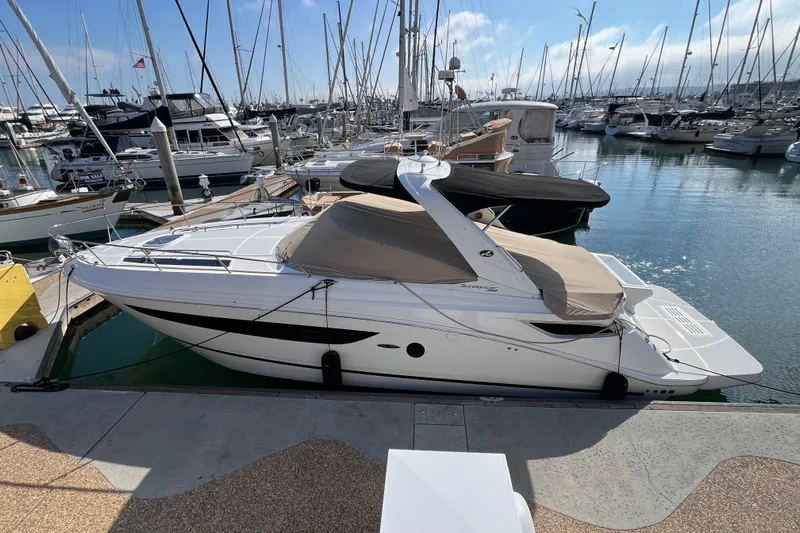 Just Plane Fun Yacht Photos Pics 2014 Sea Ray 350 Sundancer yacht docked in a marina, surrounded by sailboats.