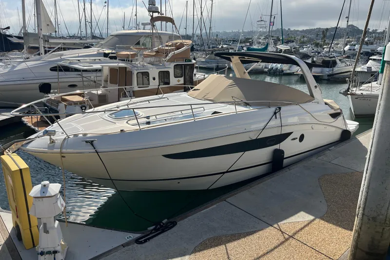 Just Plane Fun Yacht Photos Pics 2014 Sea Ray 350 Sundancer yacht docked at marina, surrounded by other boats.