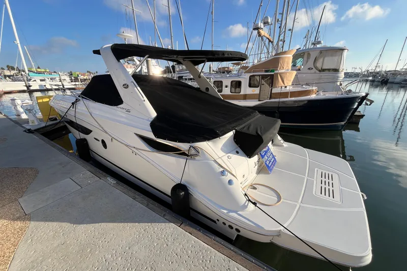 Just Plane Fun Yacht Photos Pics 2014 Sea Ray 350 Sundancer docked at marina, covered in black canvas.