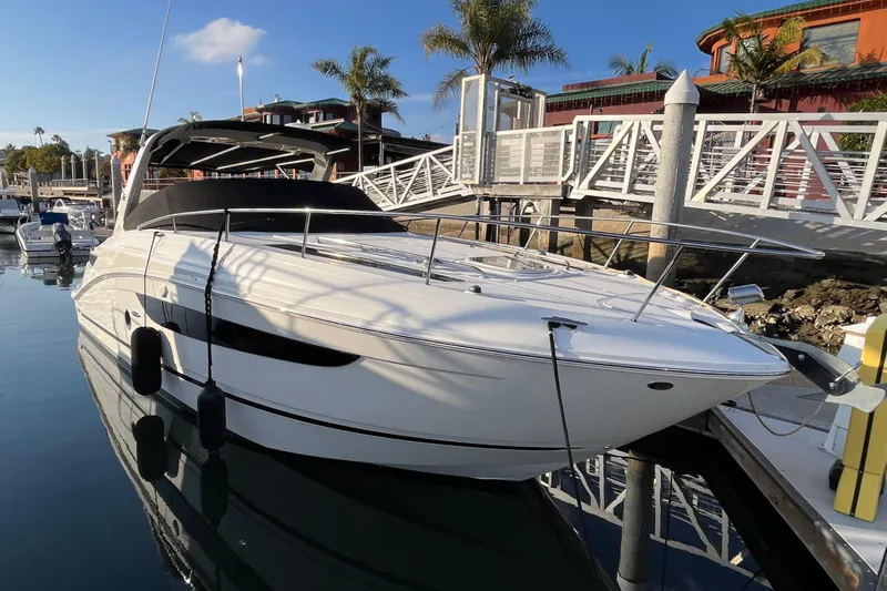 Just Plane Fun Yacht Photos Pics 2014 Sea Ray 350 Sundancer docked at marina with clear blue sky.
