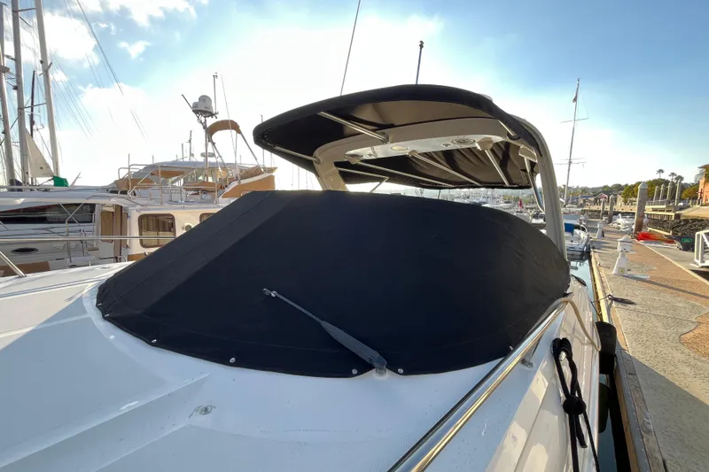 Just Plane Fun Yacht Photos Pics 2014 Sea Ray 350 Sundancer yacht docked at marina with covered windshield.