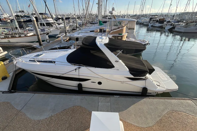 Just Plane Fun Yacht Photos Pics 2014 Sea Ray 350 Sundancer yacht docked in a marina, surrounded by other boats.