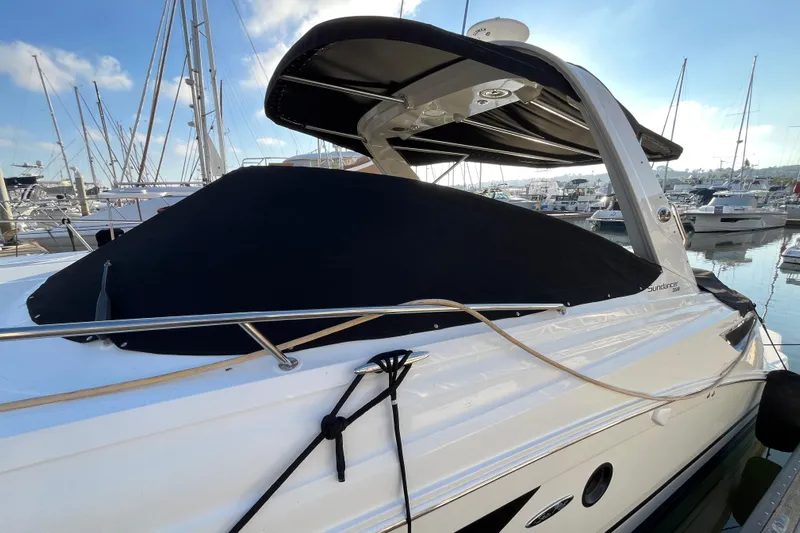 Just Plane Fun Yacht Photos Pics 2014 Sea Ray 350 Sundancer yacht docked at marina under clear blue sky.