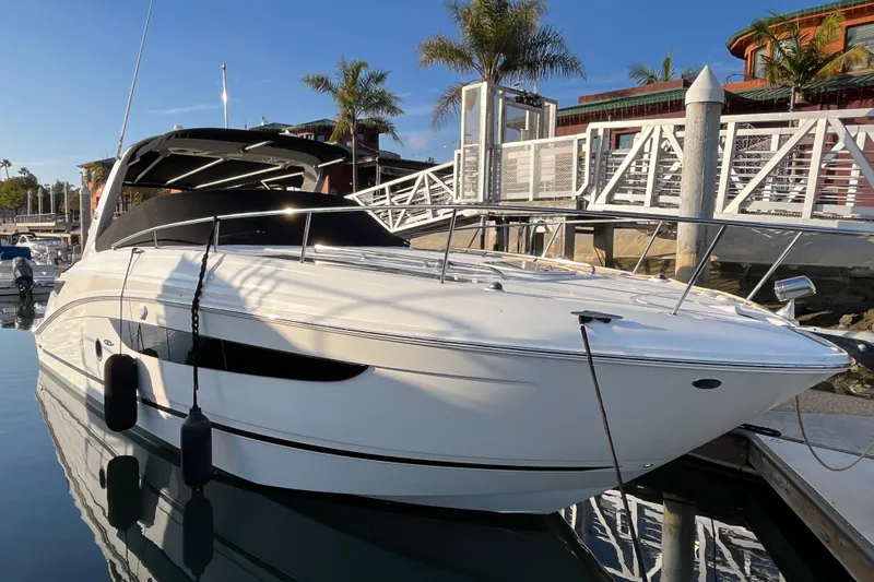 Just Plane Fun Yacht Photos Pics 2014 Sea Ray 350 Sundancer yacht docked at marina with palm trees.