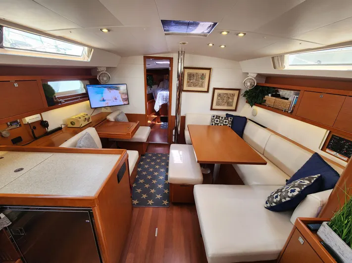 Day One Yacht Photos Pics Luxurious interior of 2016 Beneteau Oceanis 45 yacht with modern furnishings and ample seating.