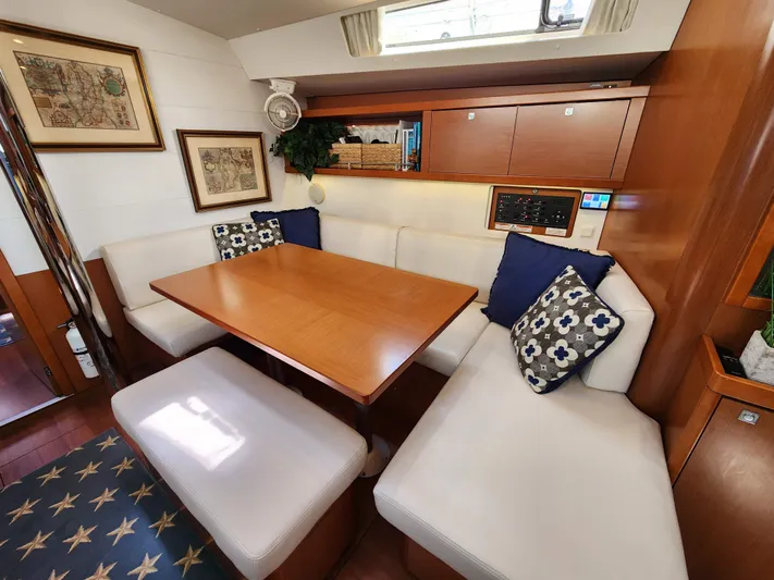 Day One Yacht Photos Pics Interior of 2016 Beneteau Oceanis 45 yacht with cozy seating and elegant decor.