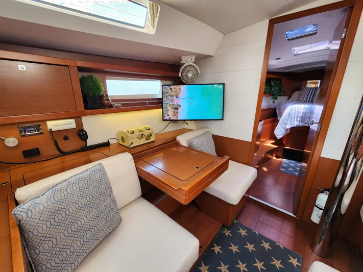 Day One Yacht Photos Pics Interior of 2016 Beneteau Oceanis 45 yacht with cozy seating and modern amenities.