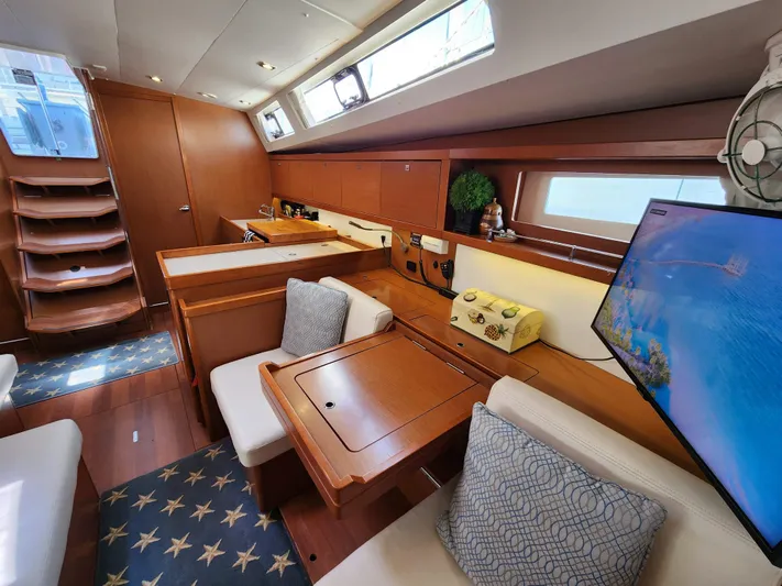 Day One Yacht Photos Pics Luxurious interior of 2016 Beneteau Oceanis 45 yacht with modern amenities and elegant design.