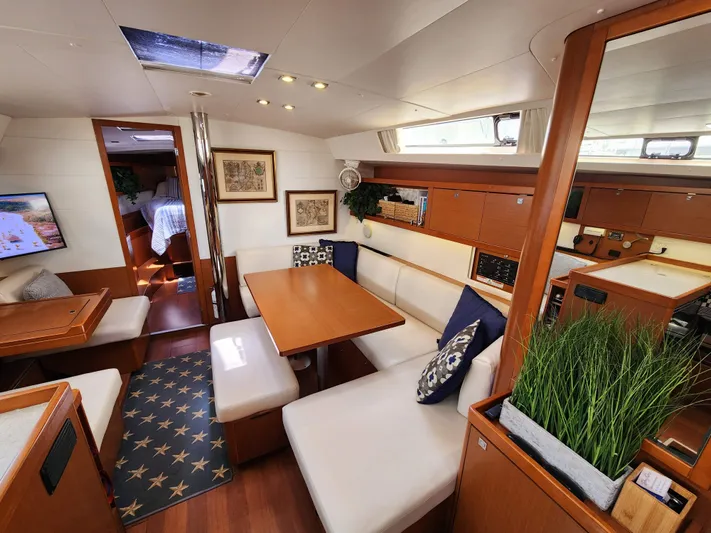 Day One Yacht Photos Pics Interior of 2016 Beneteau Oceanis 45 yacht, featuring elegant seating and modern decor.