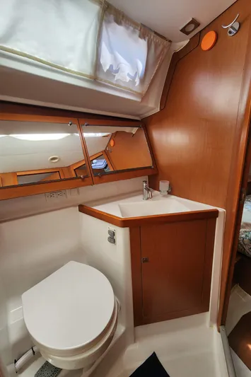 Day One Yacht Photos Pics 2016 Beneteau Oceanis 45 yacht bathroom with wood accents and modern fixtures.