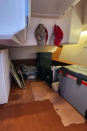 Day One Yacht Photos Pics Interior storage area of 2016 Beneteau Oceanis 45 sailboat with equipment and accessories.