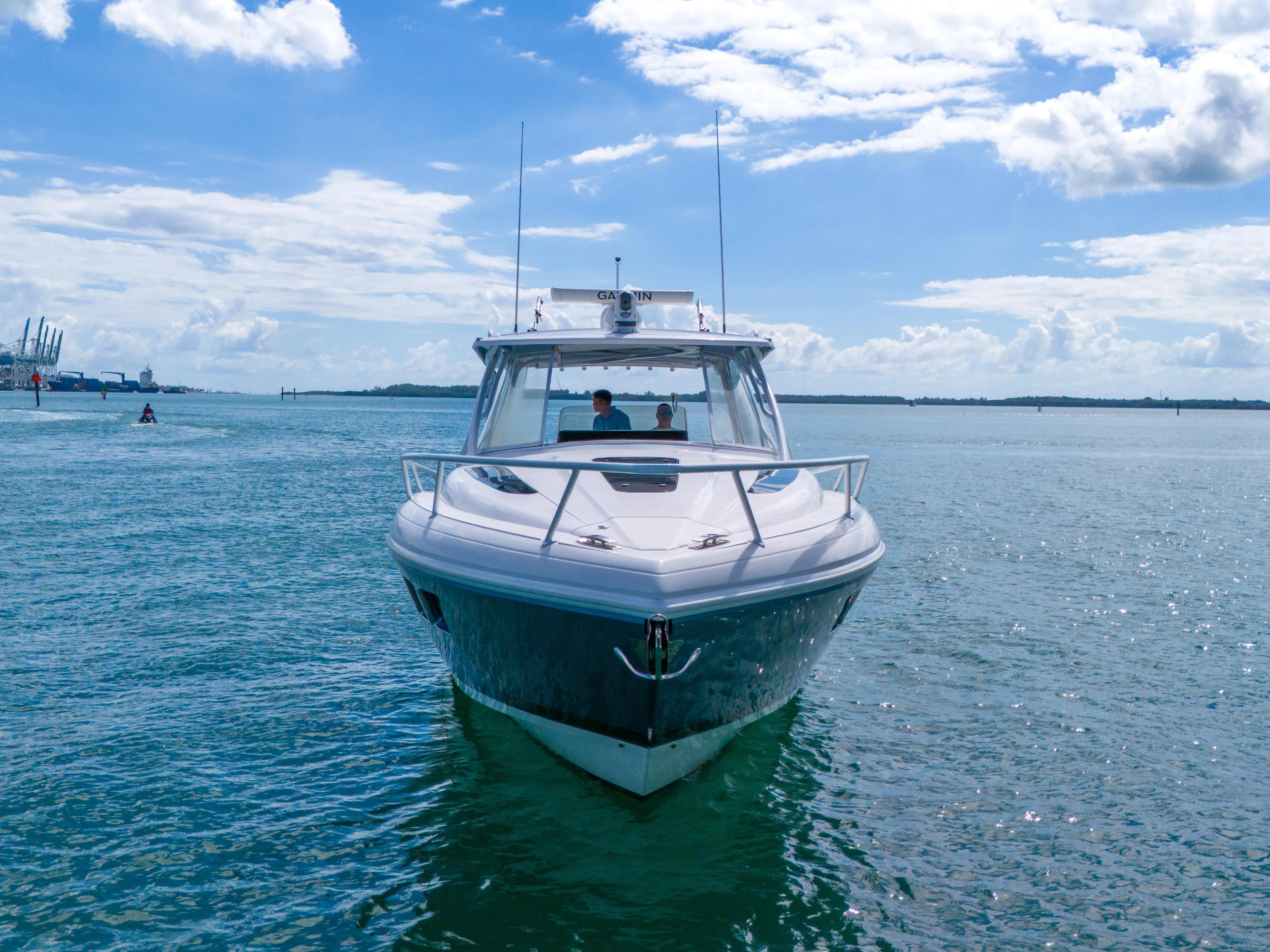  Yacht Photos Pics 2019 Intrepid 407 Cuddy boat cruising on open water under a blue sky.