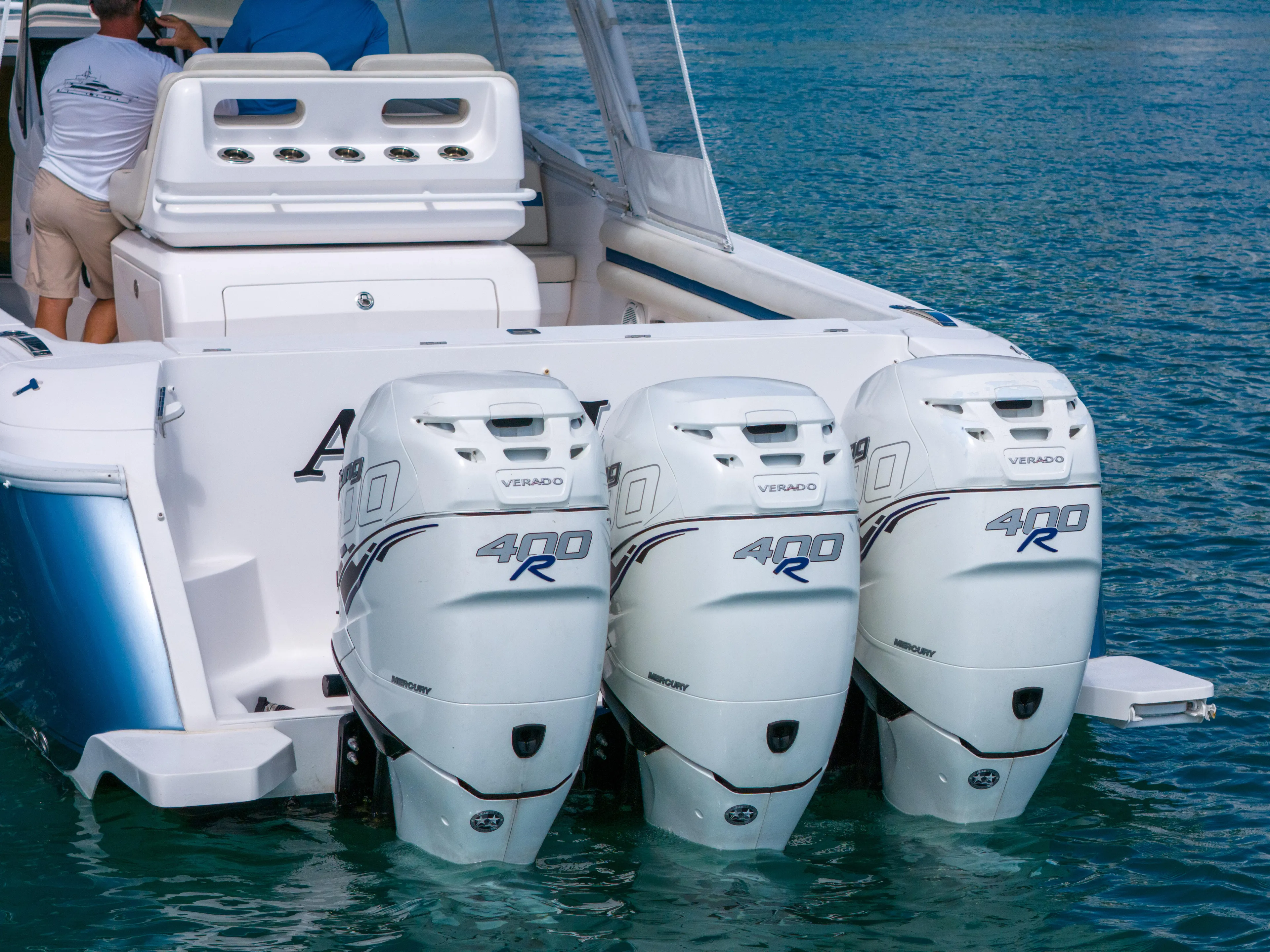  Yacht Photos Pics 2019 Intrepid 407 Cuddy with triple outboard engines on water.