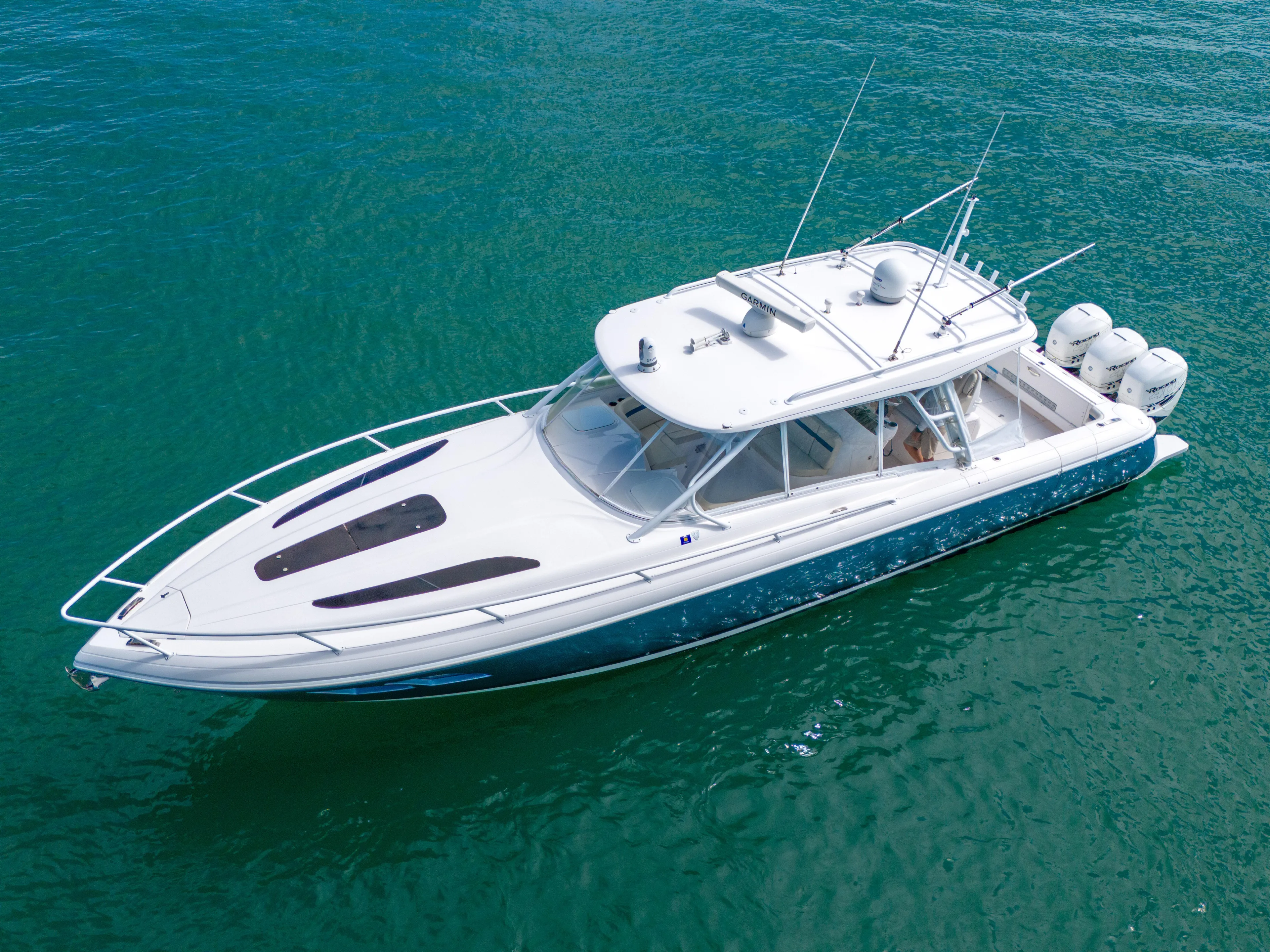  Yacht Photos Pics 2019 Intrepid 407 Cuddy boat on clear blue water, aerial view.