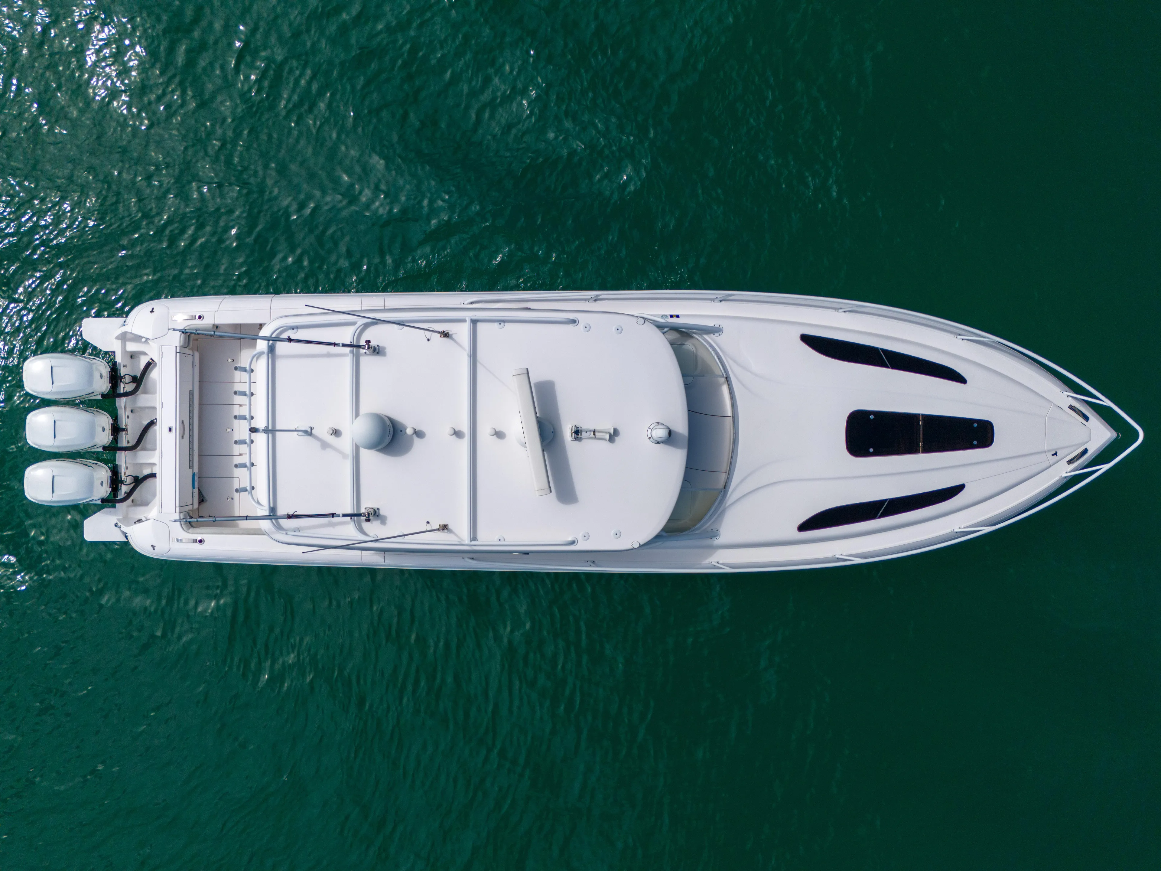  Yacht Photos Pics Aerial view of 2019 Intrepid 407 Cuddy boat on clear water.