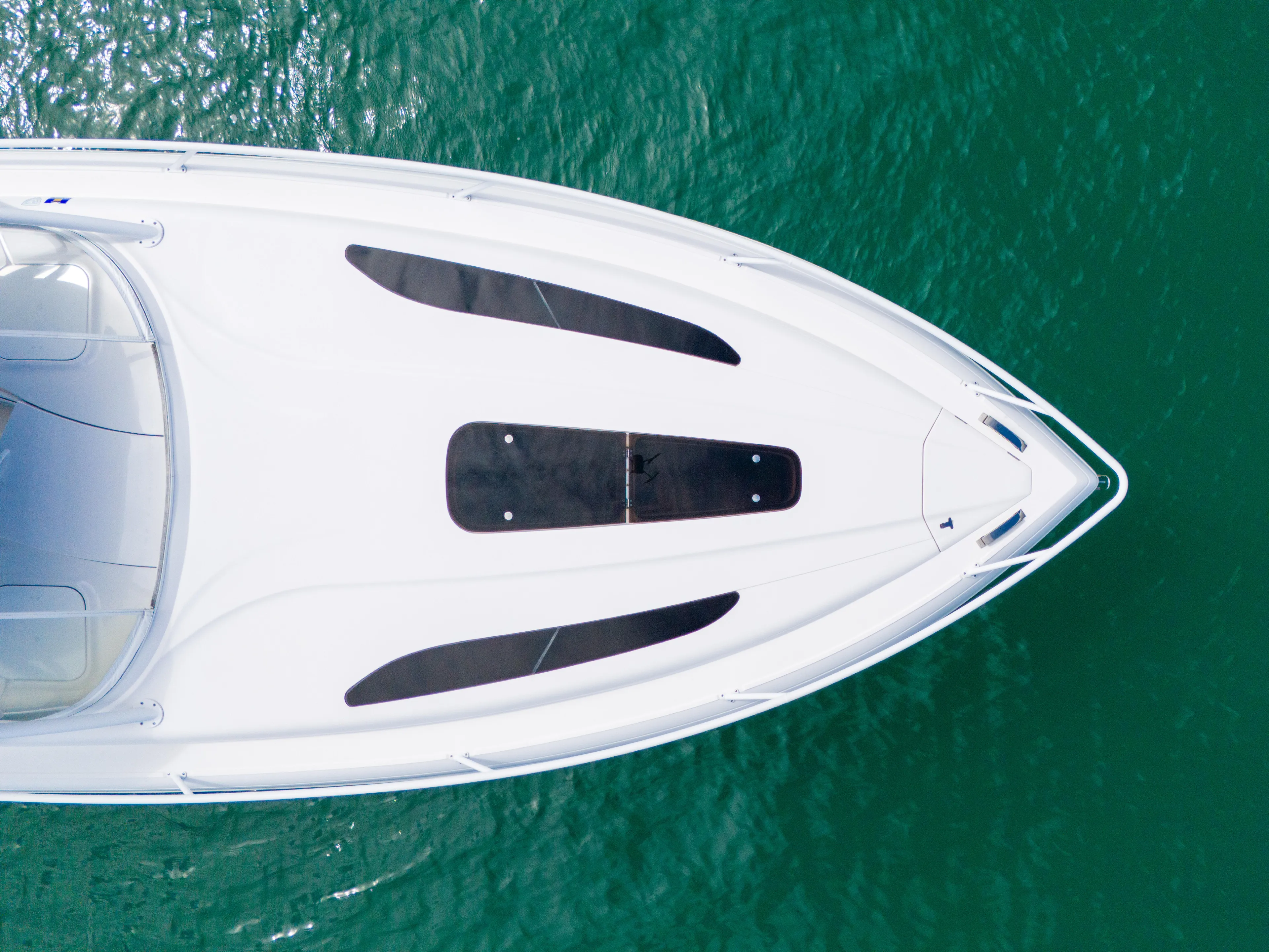  Yacht Photos Pics Aerial view of 2019 Intrepid 407 Cuddy boat on clear water.
