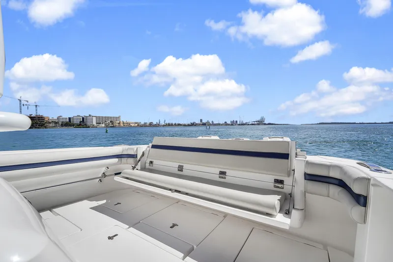  Yacht Photos Pics 2019 Intrepid 407 Cuddy boat interior with ocean view and clear blue sky.