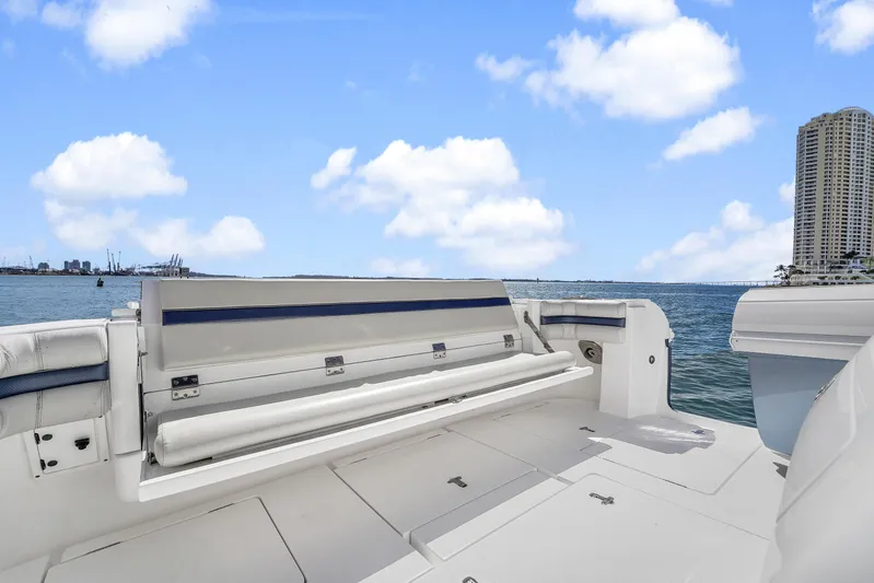  Yacht Photos Pics 2019 Intrepid 407 Cuddy boat deck with ocean view and city skyline.