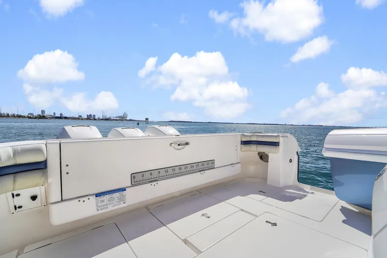  Yacht Photos Pics 2019 Intrepid 407 Cuddy boat deck with ocean view and clear blue sky.