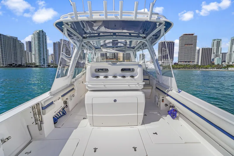  Yacht Photos Pics 2019 Intrepid 407 Cuddy boat on water with city skyline in background.