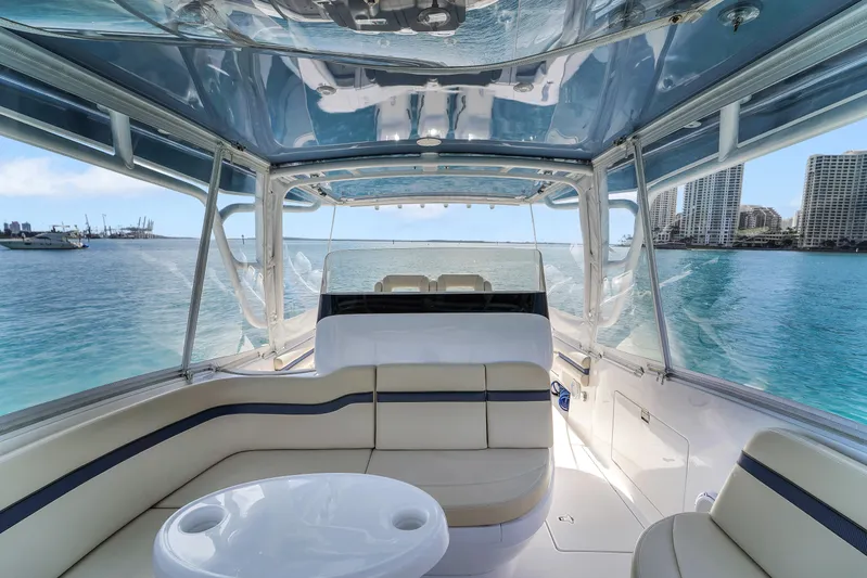  Yacht Photos Pics 2019 Intrepid 407 Cuddy interior with ocean view, featuring comfortable seating and sleek design.