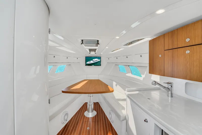  Yacht Photos Pics Luxurious interior of 2019 Intrepid 407 Cuddy boat with modern amenities and sleek design.