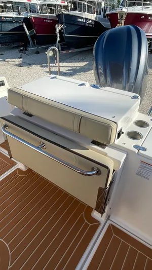  Yacht Photos Pics 2023 Ranger Tugs R-27 boat interior with seating and storage features.