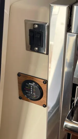  Yacht Photos Pics 2023 Ranger Tugs R-27 interior control panel with switches and gauge.