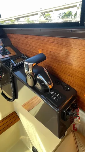  Yacht Photos Pics 2023 Ranger Tugs R-27 boat interior with control panel and throttle lever.