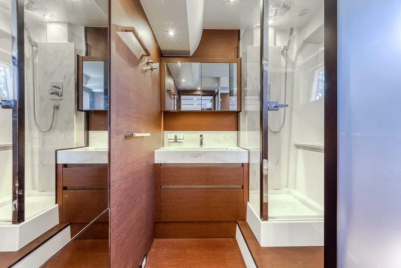 Knightlife Yacht Photos Pics Luxurious bathroom interior on 2017 Prestige 630 yacht, featuring modern fixtures and elegant wood finishes.