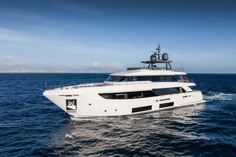 M Forever Yacht Photos Pics Luxurious 2021 Custom Line Navetta 33 yacht cruising on open sea under clear skies.