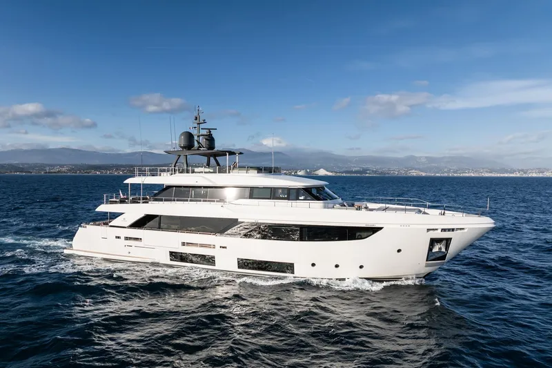 M Forever Yacht Photos Pics Luxurious 2021 Custom Line Navetta 33 yacht cruising on open sea under clear skies.
