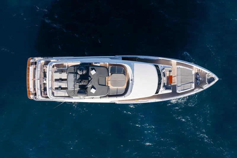 M Forever Yacht Photos Pics Aerial view of 2021 Custom Line Navetta 33 yacht on deep blue ocean.