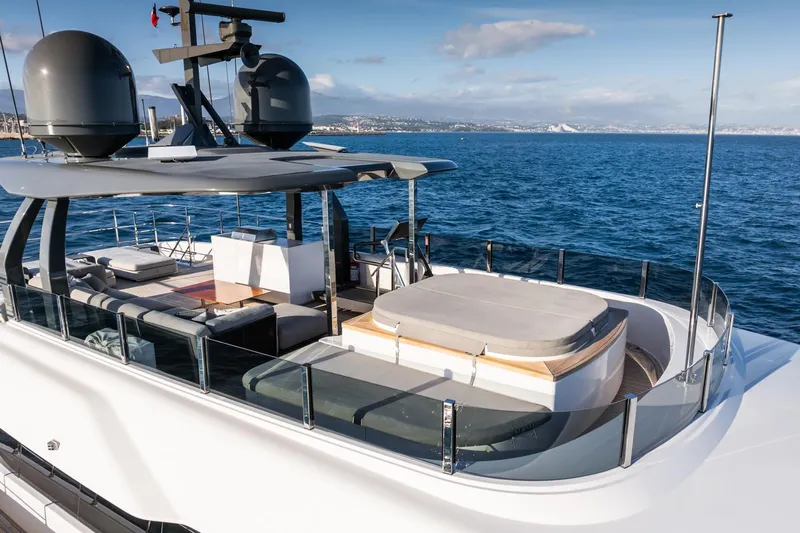 M Forever Yacht Photos Pics Luxurious 2021 Custom Line Navetta 33 yacht on open sea, featuring spacious deck and modern design.